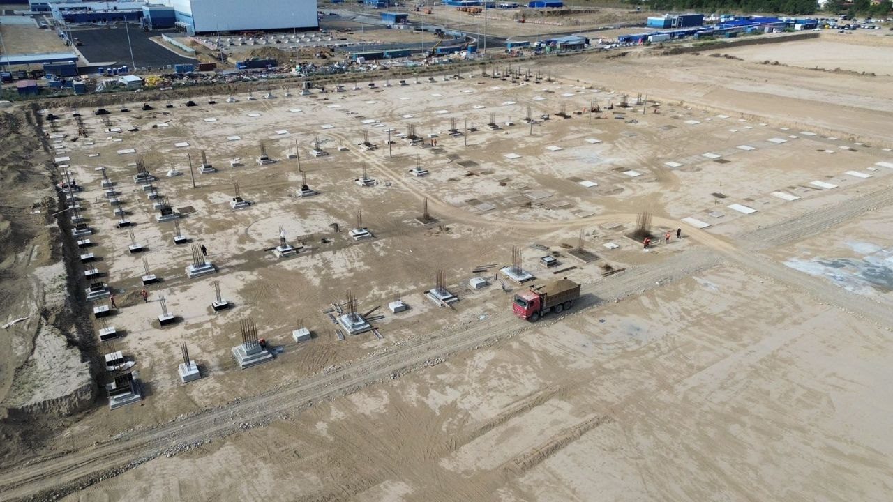 Grid of concrete pockets with rebar starters